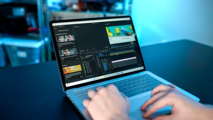 Someone application the Surface Laptop Studio 2 with Adobe Premiere Pro. 