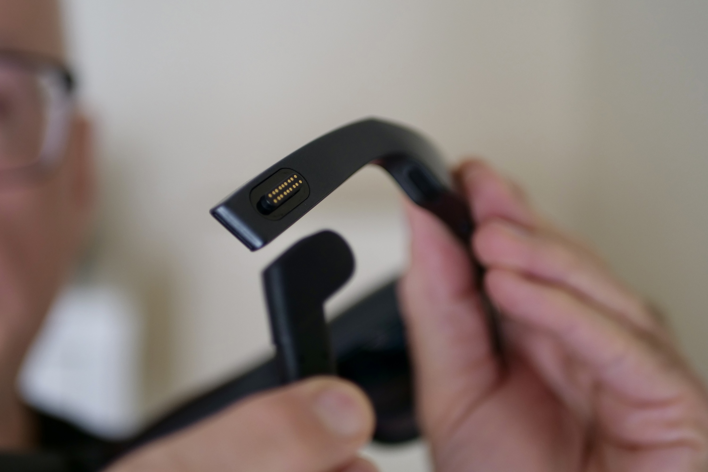 The TCL RayNeo Nxtwear S XR glasses's USB C cable being taken off.