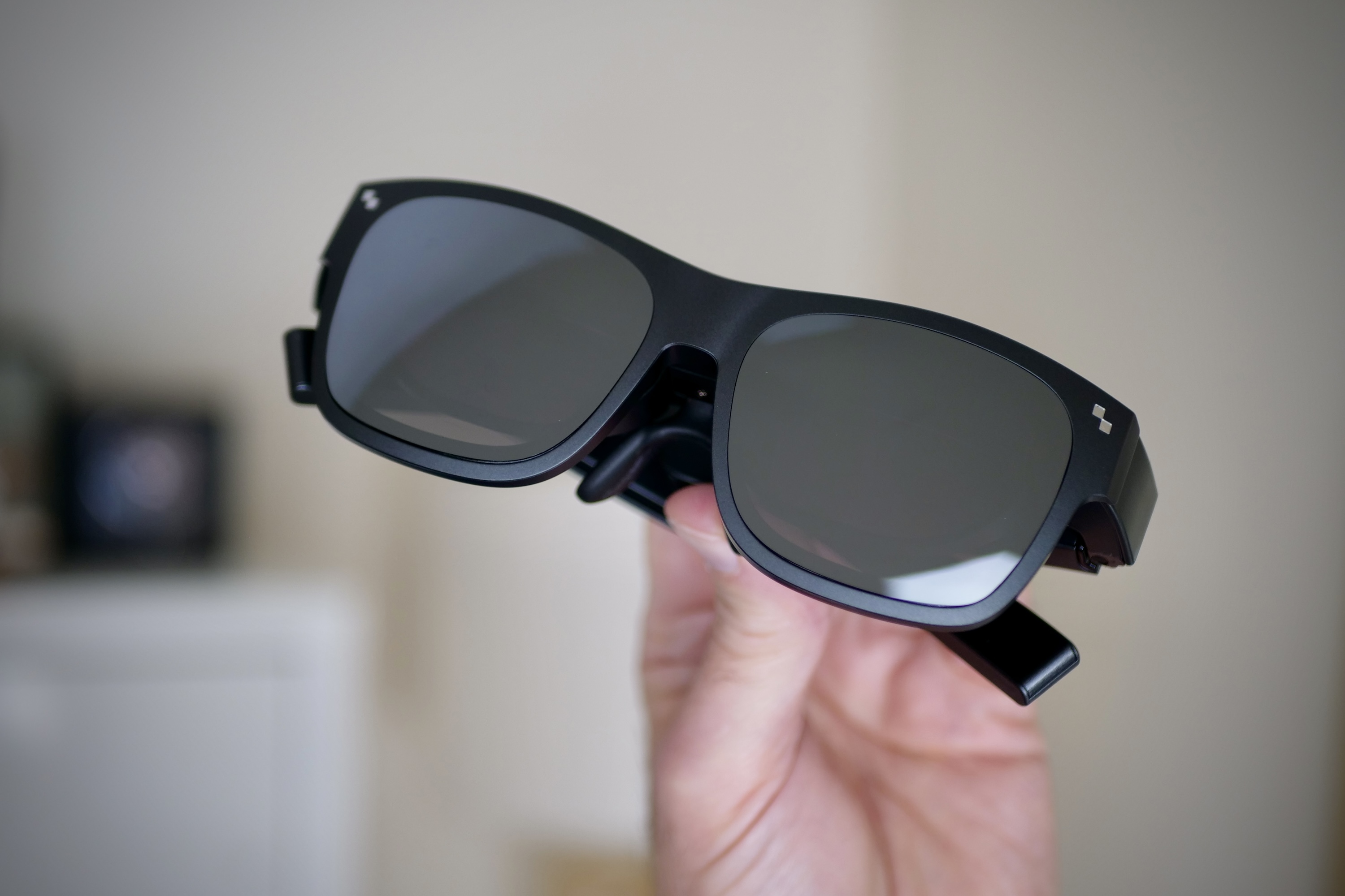 The TCL RayNeo Nxtwear S XR glasses with the sunglass attachment.