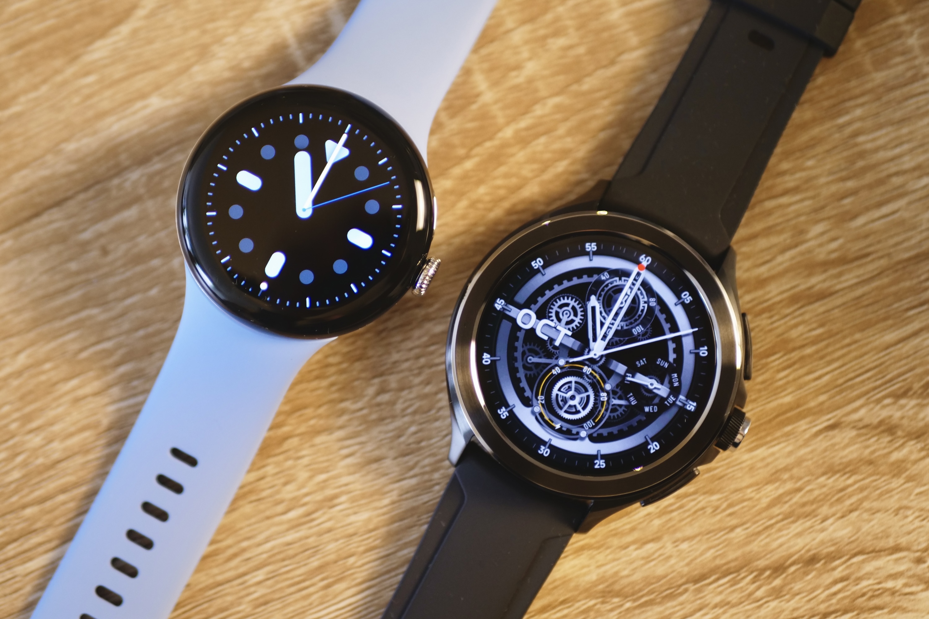 The Xiaomi Watch 2 Pro and the Pixel Watch 2, seen from the front.