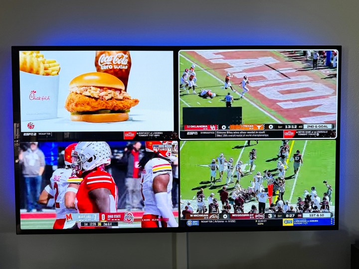 Three college football games (and one ad) seen on a large TV on YouTube TV.