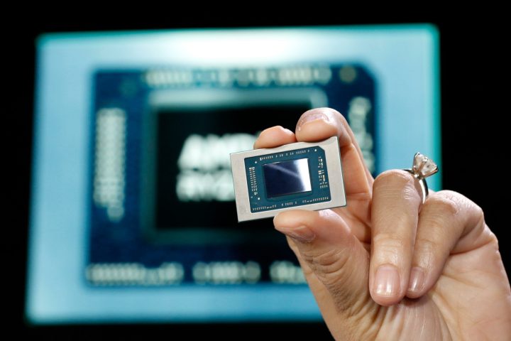 AMD CEO Lisa Su holding an APU chip.
