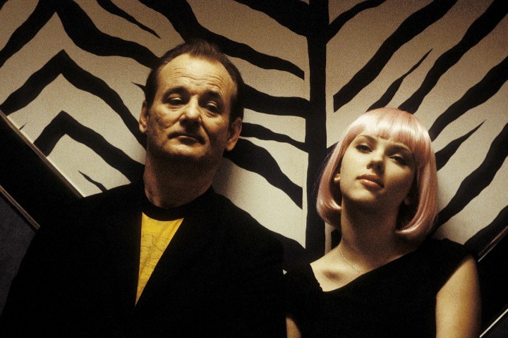 Bill Murray and Scarlett Johansson sit together in Lost in Translation.