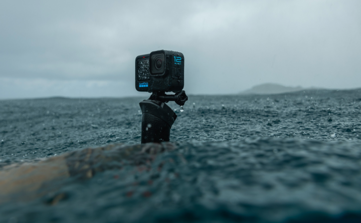 The GoPro Hero 12 action camera recording water on a beach.