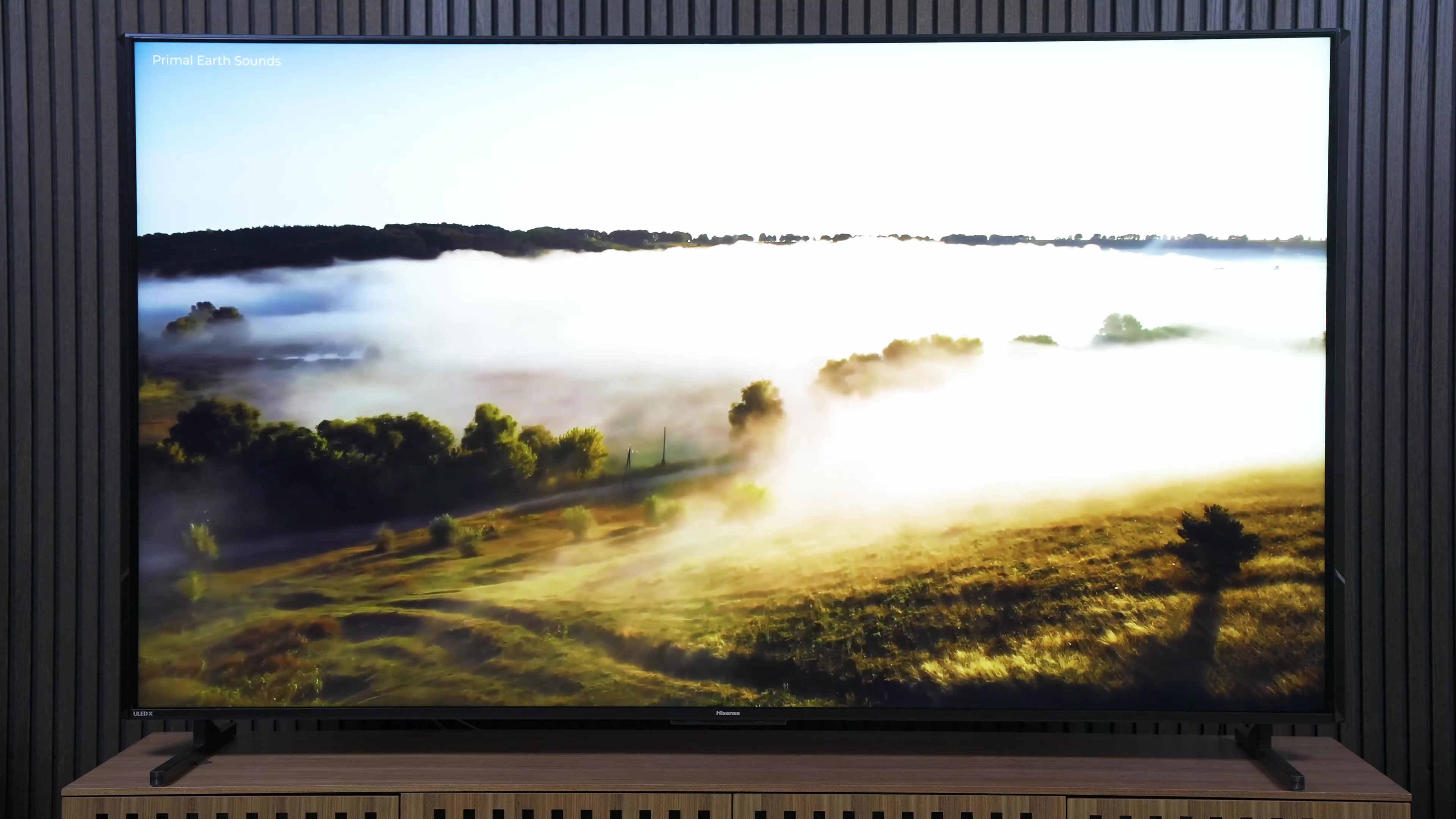 Low-lying fog over a valley shown on a Hisense UX TV. 