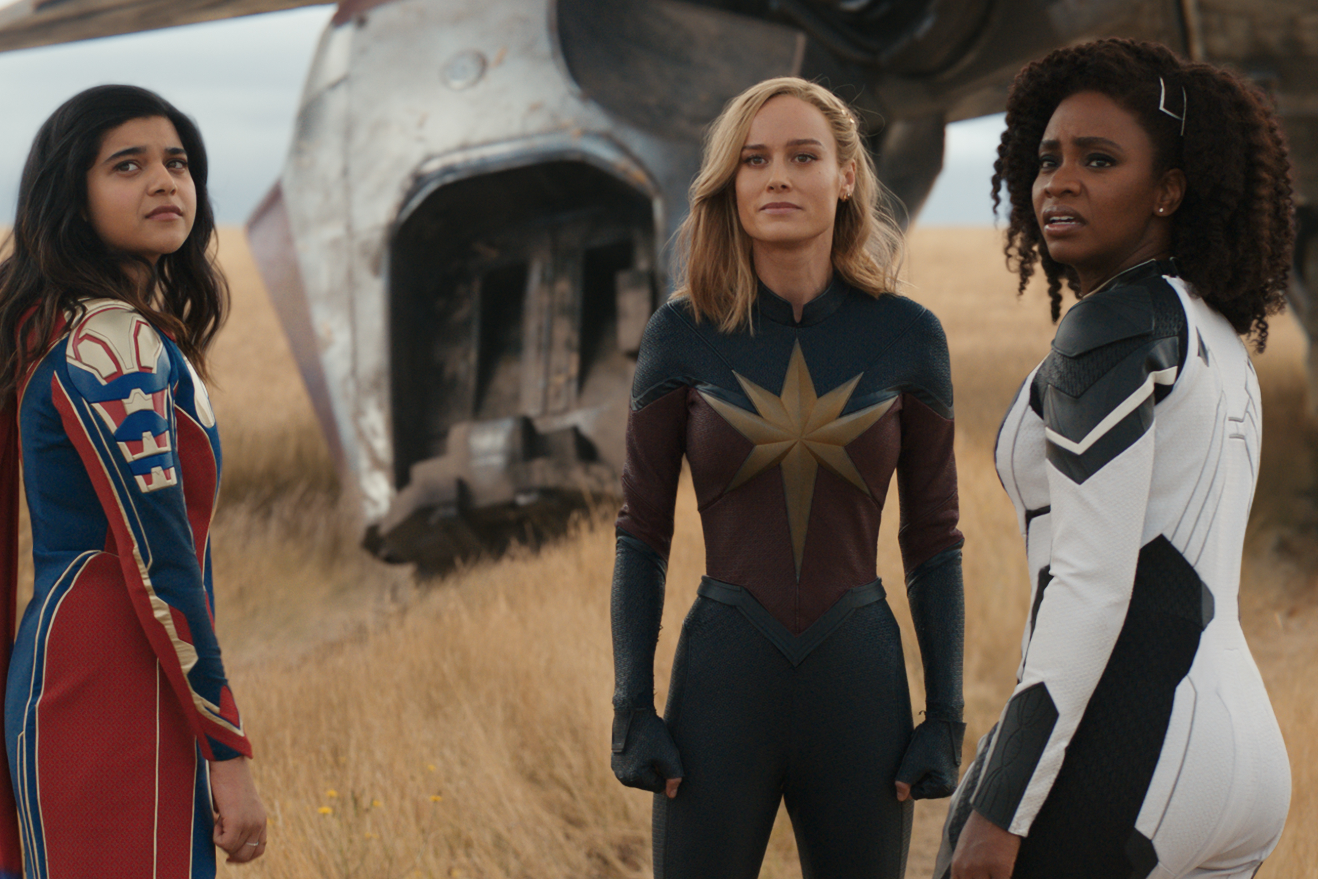 Kamala, Carol, and Monica stand in a field together in The Marvels.
