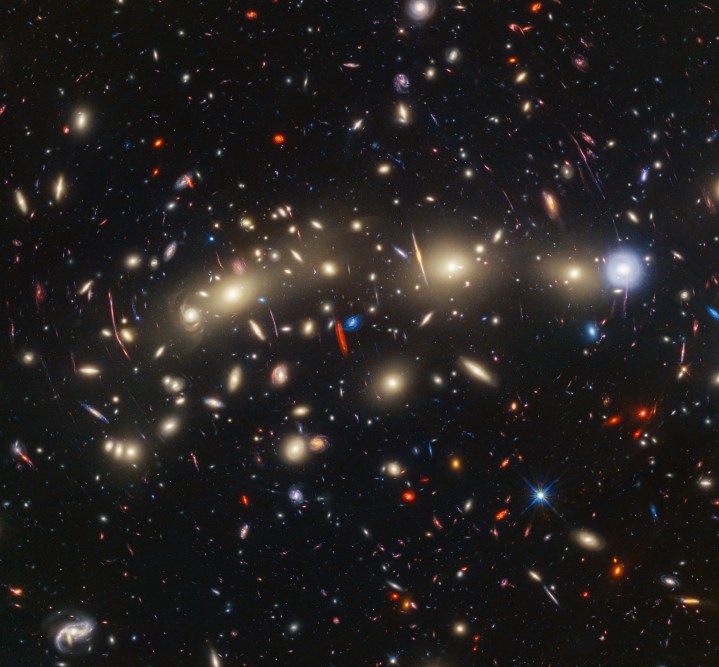 This panchromatic view of galaxy cluster MACS0416 was created by combining infrared observations from NASA’s James Webb Space Telescope with visible-light data from NASA’s Hubble Space Telescope. To make the image, in general the shortest wavelengths of light were color-coded blue, the longest wavelengths red, and intermediate wavelengths green. The resulting wavelength coverage, from 0.4 to 5 microns, reveals a vivid landscape of galaxies that could be described as one of the most colorful views of the universe ever created.