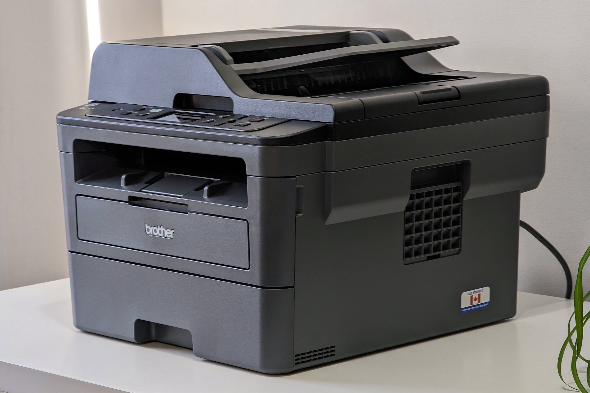 The Brother DCPL2550DW. has a tapered design with vents on both sides.
