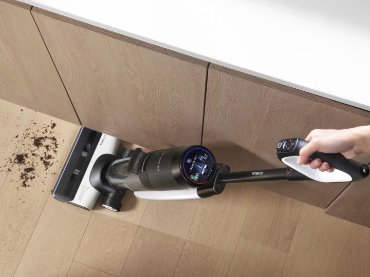 Tineco FLOOR ONE S7 PRO cleaning spill with LCD visible