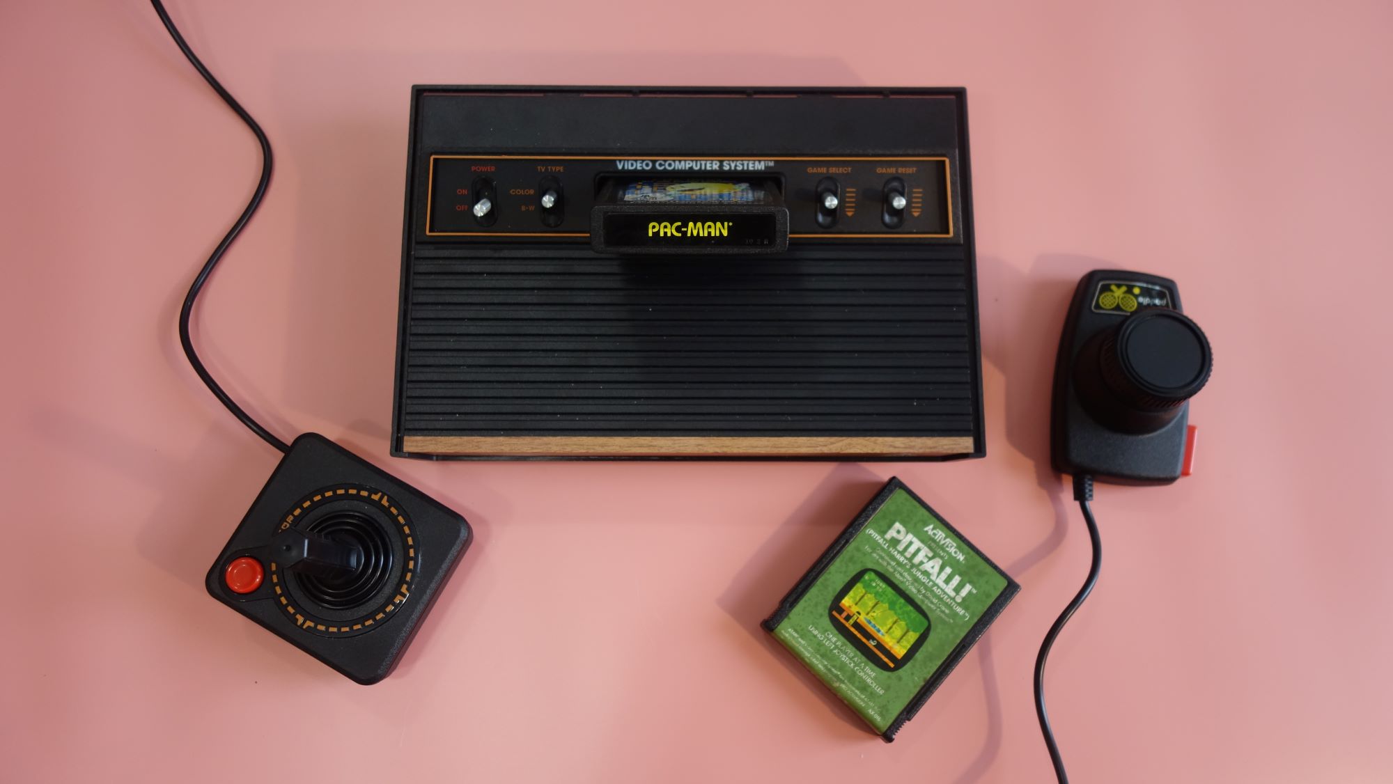 An Atari 2600+ sits on a table.