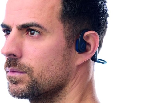 A man wearing the Attitud EarSport headphones.