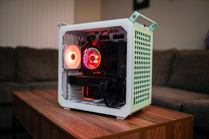 Cooler Master Qube 500 PC case sitting on a coffee table.