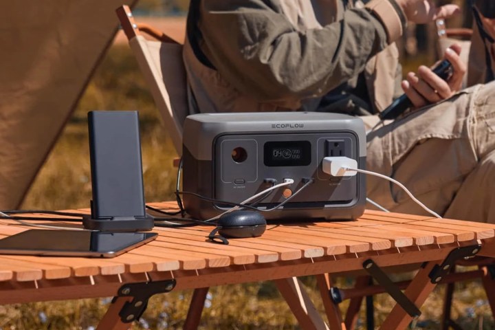 An EcoFlow River 2 portable power station sits on a camp table.