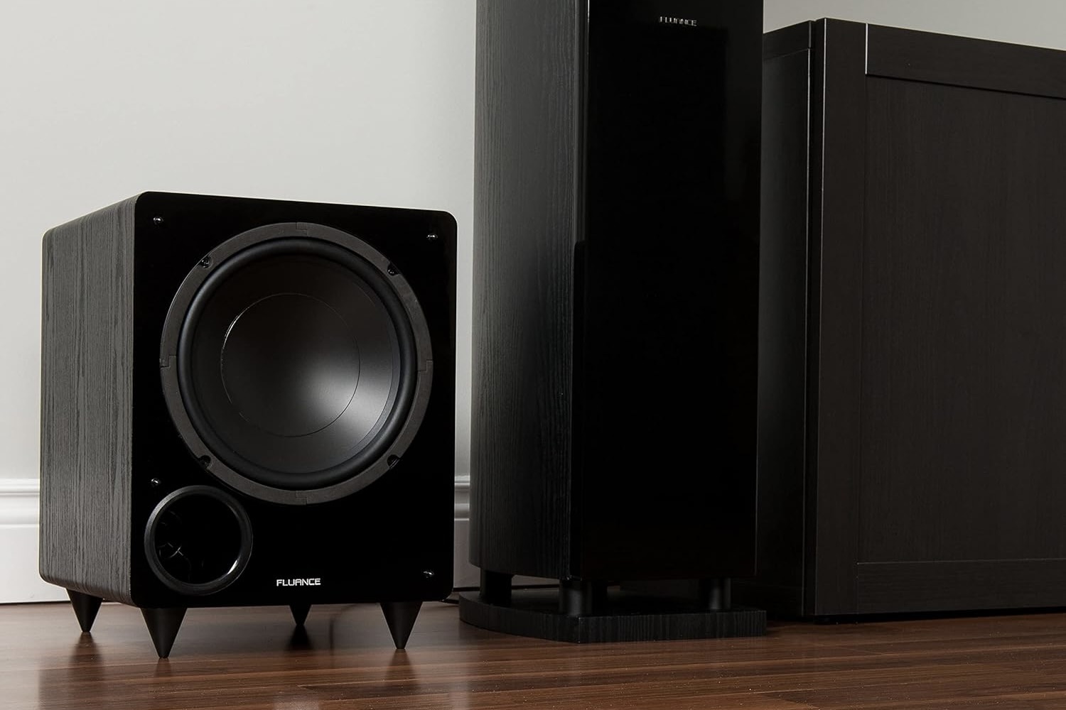 The Fluance DB10W next to a tower speaker.