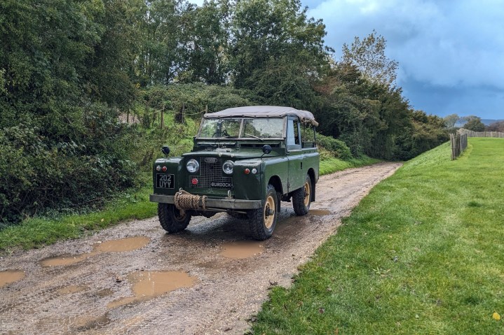 A Land Rover vehicle on a muddy track.