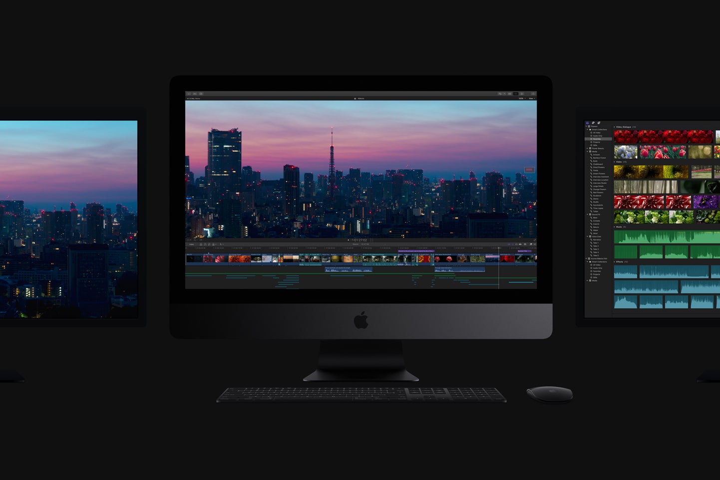 एक अंधेरे कमरे में एक Apple iMac Pro, जिसके दोनों ओर दो मॉनिटर लगे हुए हैं।