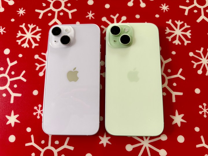 Purple iPhone 14 (left) and a green iPhone 15.