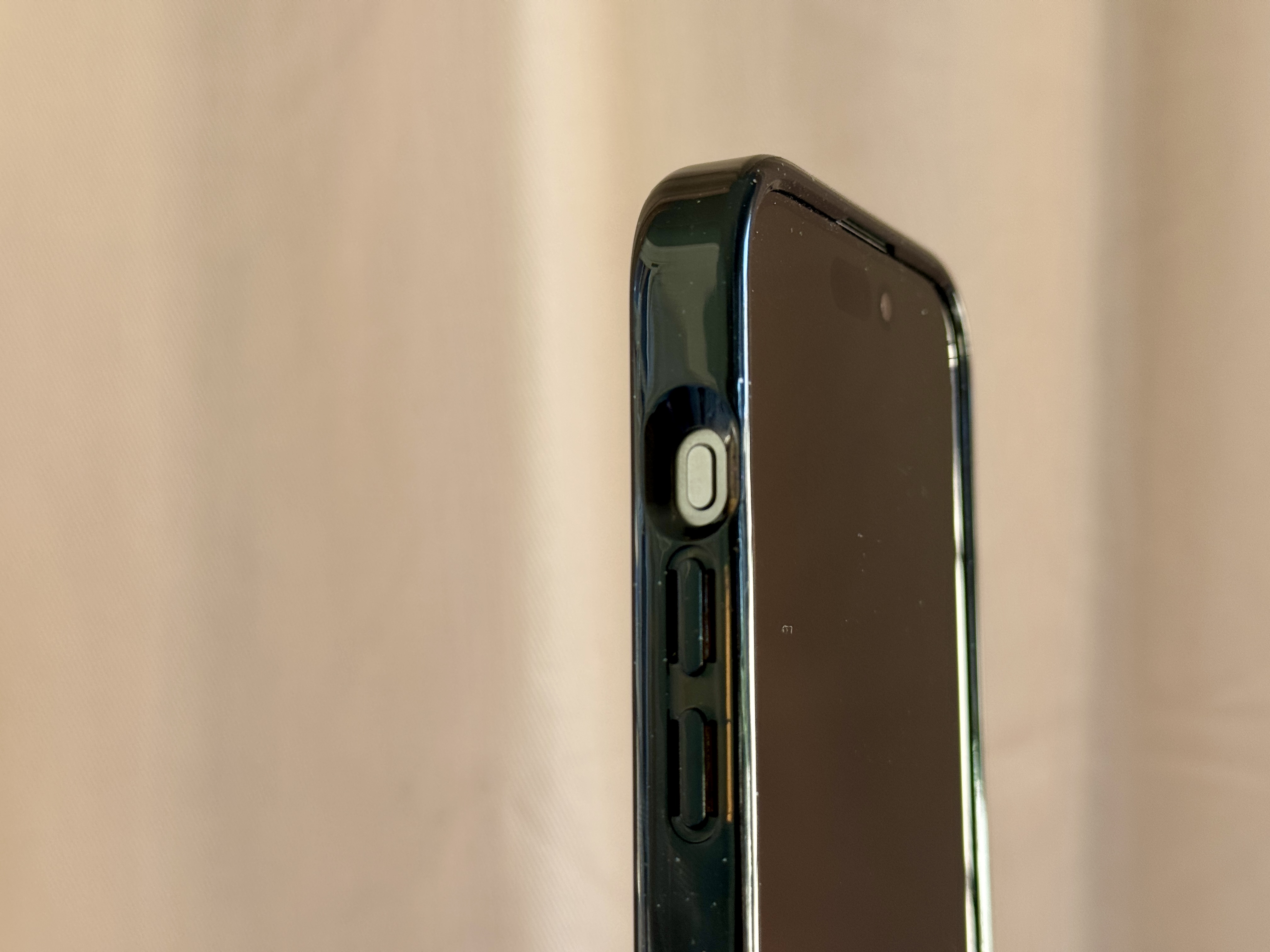 iPhone 15 Pro in Casetify Nothing Case showing action button cutout.