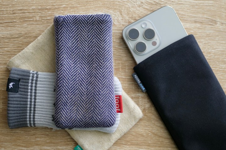 Phone pouches and the iPhone 15 Pro Max inside the Adore June pouch.