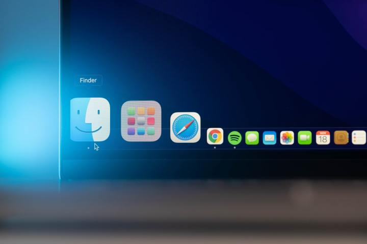 The Dock in macOS showing apps like Safari, Google Chrome, Spotify, the Finder, and more.