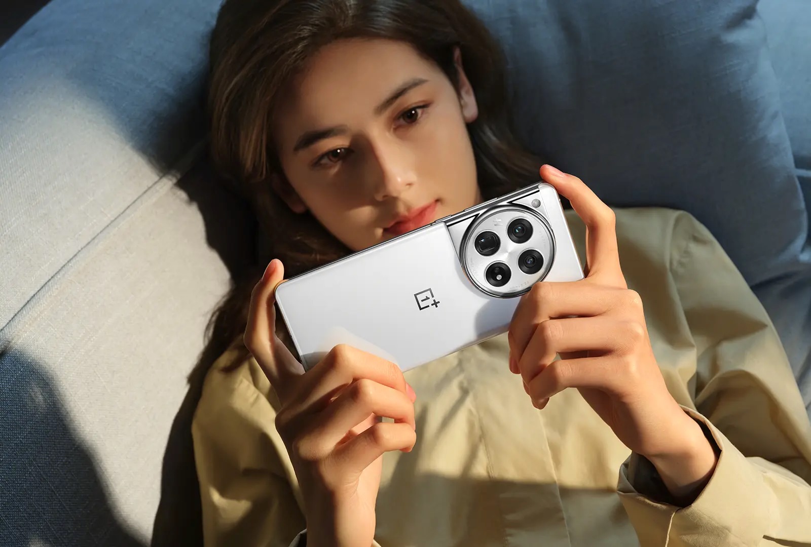 Woman holding a OnePlus 12.