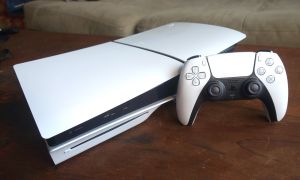 A PS5 sits on a table.