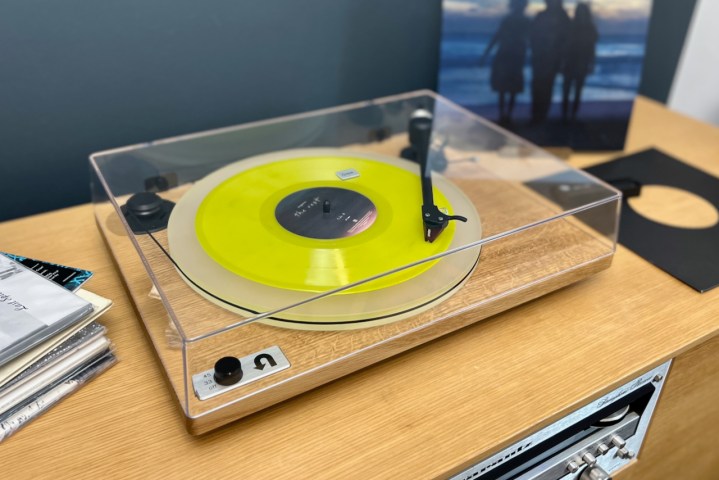 The U-Turn Orbit Special turntable with a yellow racord on the platter.