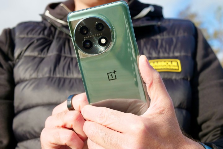 A person using the OnePlus 11.