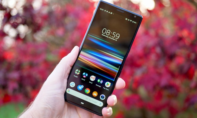 A person holding the Sony Xperia 10 Plus, showing the screen.