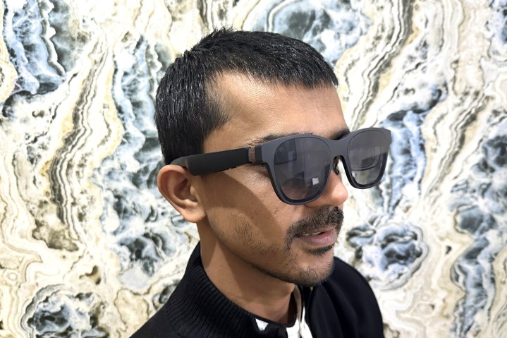 Person wearing Xreal Air 2 glasses.