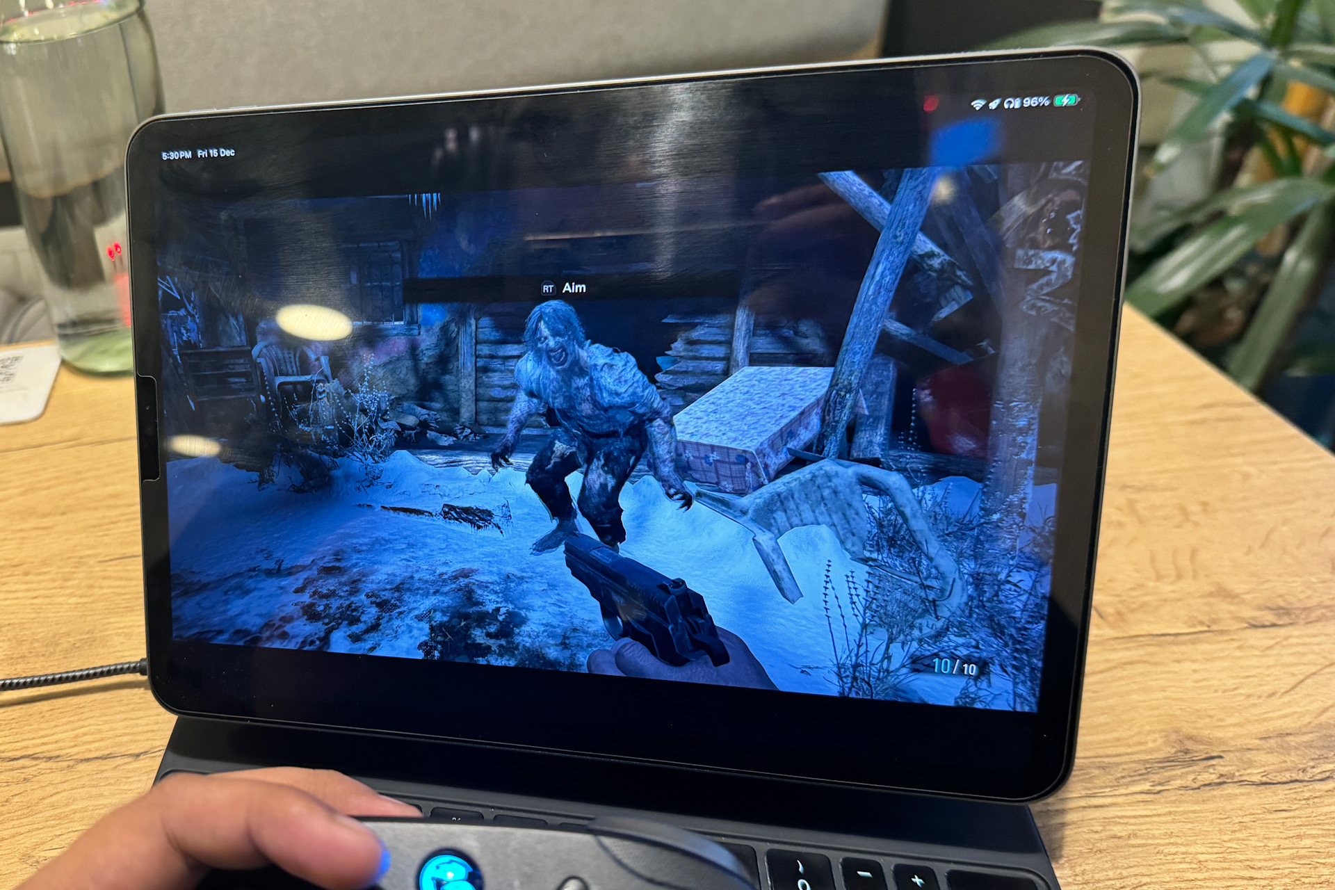 Facing a monster in Resident Evil Village on iPad Pro.