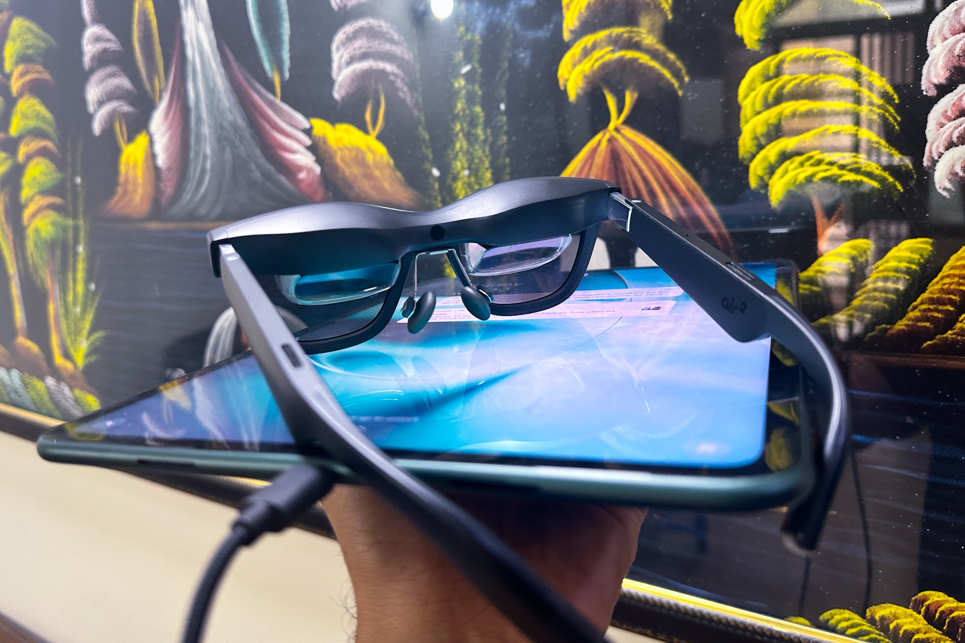 Xreal Air 2 AR Glasses above the OnePlus Pad tablet. 