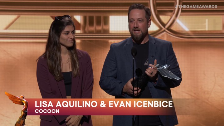 Cocoon devs accept award at The Game Awards 2023.