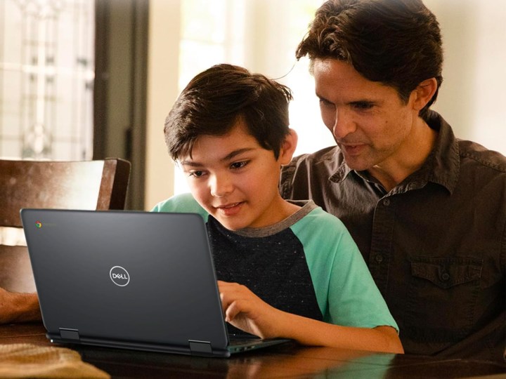 A father and son use a Dell Chromebook 11.