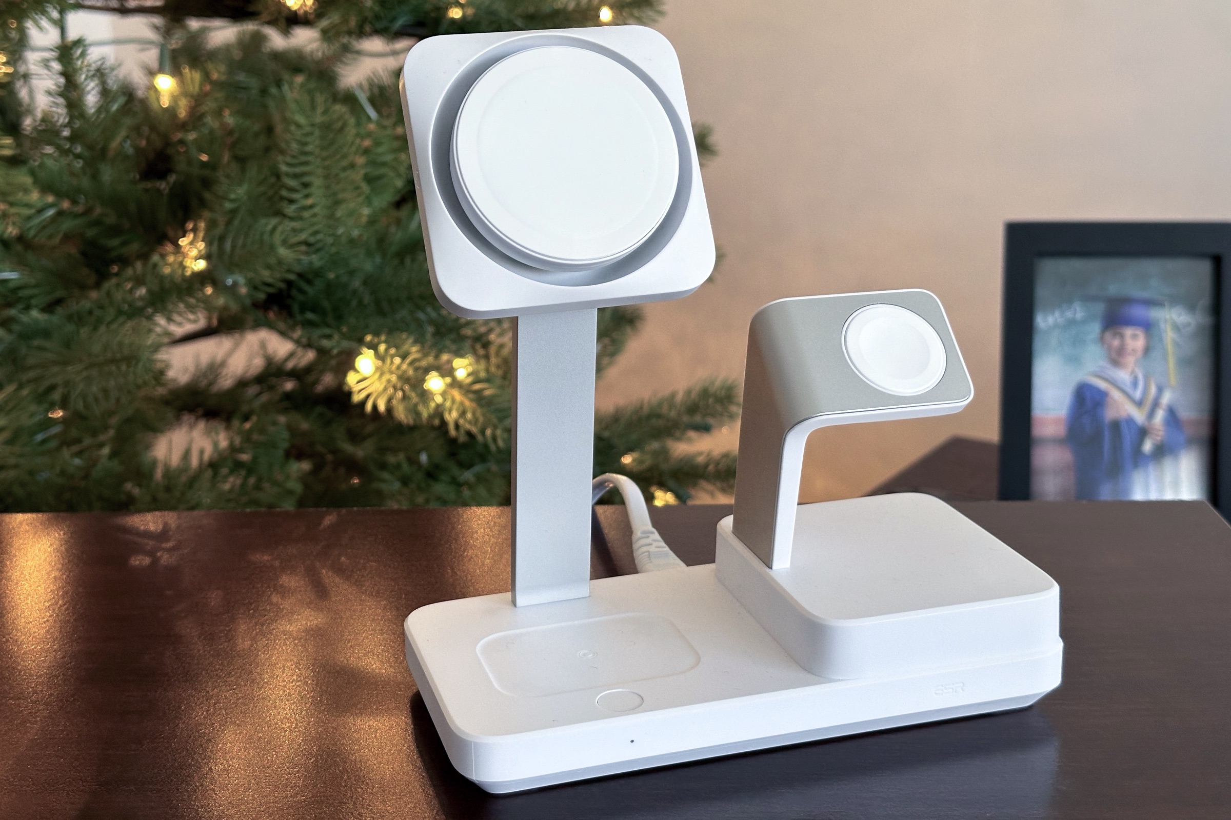 ESR's 6-in-1 charging stand on table in front of a Christmas tree.