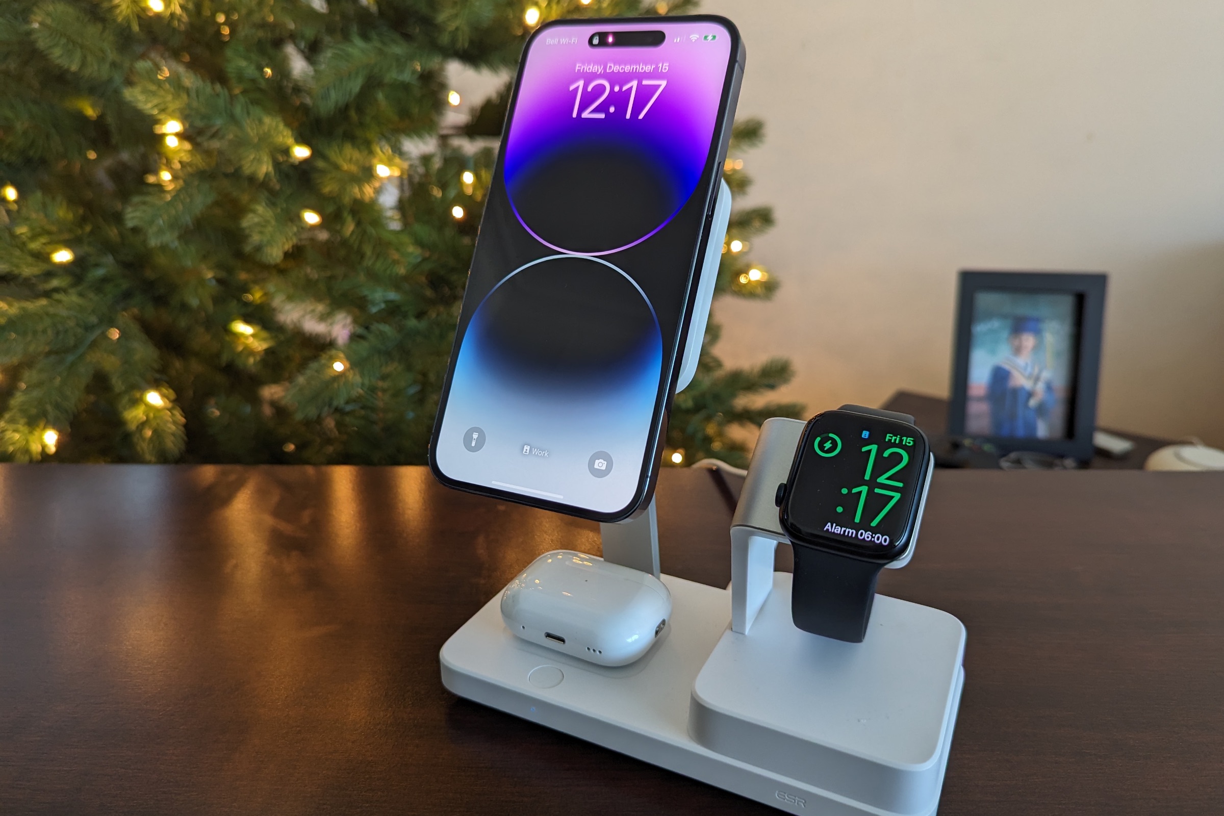 ESR 6-in-1 charging stand with iPhone 14 Pro Max, Apple Watch Series 8, and AirPods Pro docked.