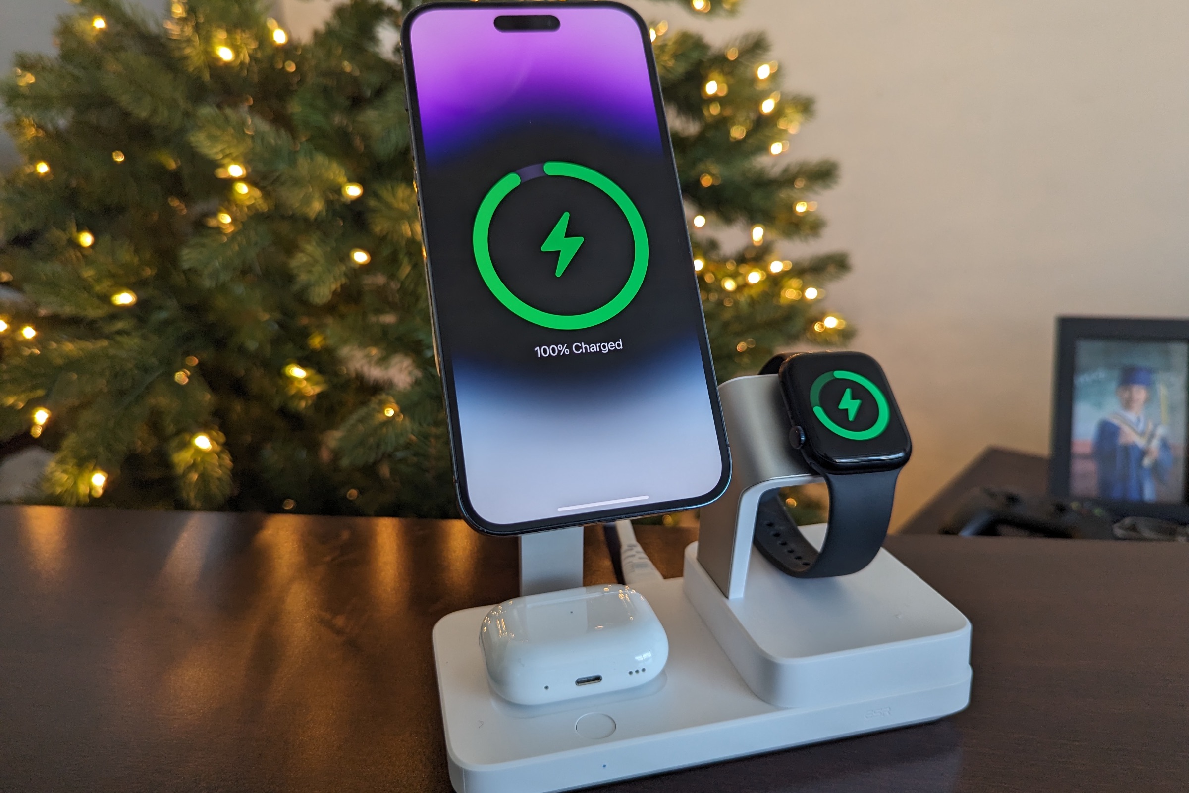 ESR 6-in-1 charging stand with iPhone 14 Pro Max, Apple Watch Series 8, and AirPods Pro showing charging status.