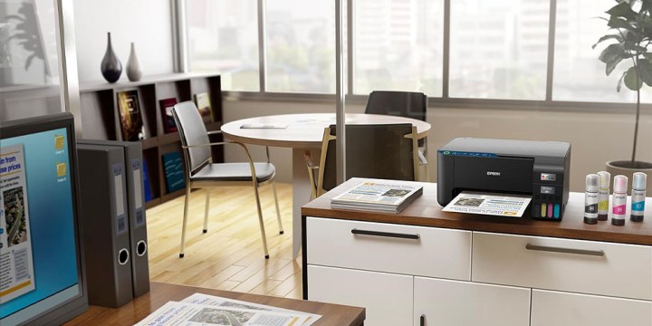 The Epson EcoTank ET-2400 on a desk in an office environment.