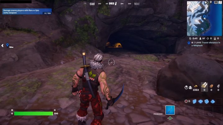 A player standing outside a cave in Fortnite.