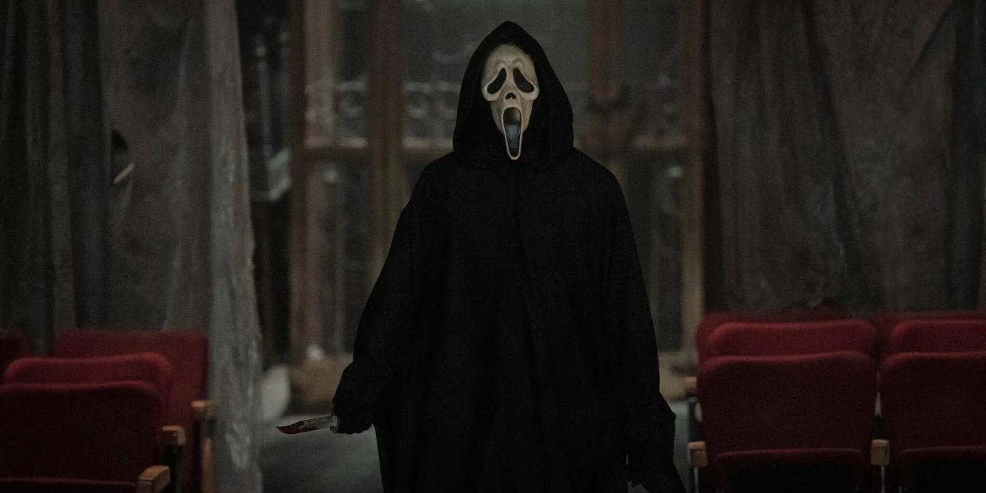 Ghostface stands in an empty theater in Scream 6