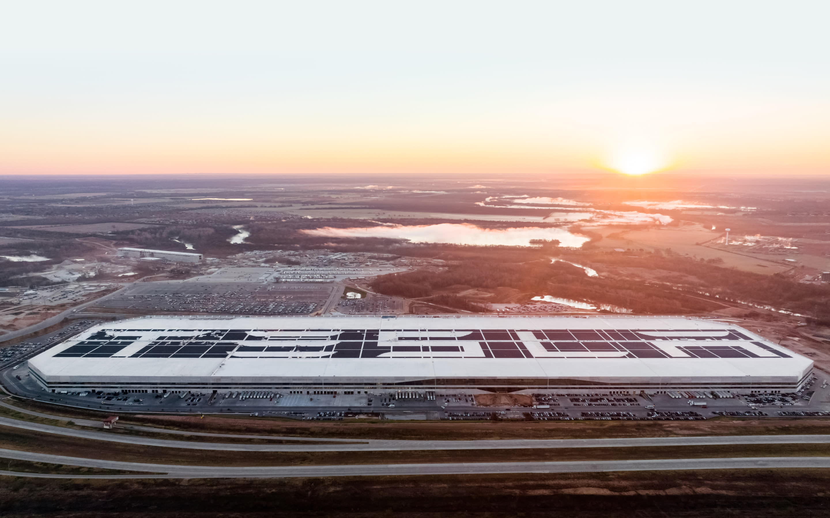 An aerial shot shows Tesla's sprawling Gigafactory in Austin, TX.