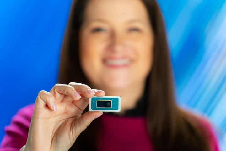 Michelle Johnston Holthaus holding an Intel Core Ultra CPU.