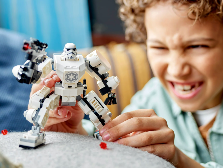 A child playing with the Stormtrooper Lego Set.