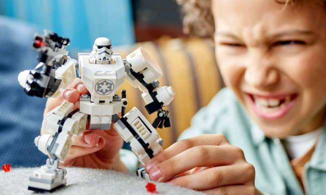 A child playing with the Stormtrooper Lego Set.