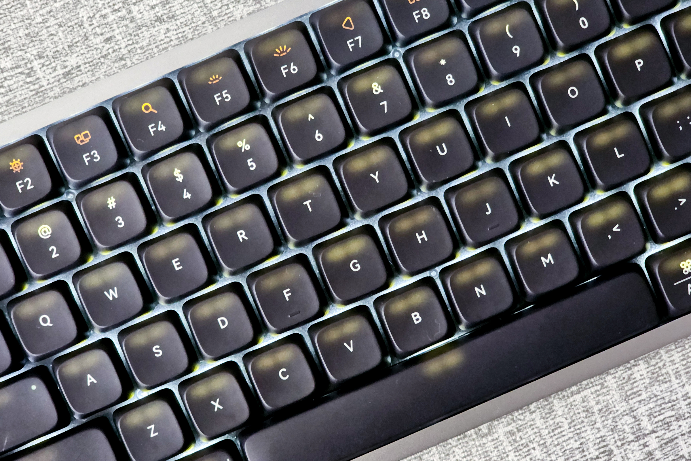 Backlight bleeding through black dye-sub PBT keycaps on Lofree Flow low-profile mechanical keyboard.