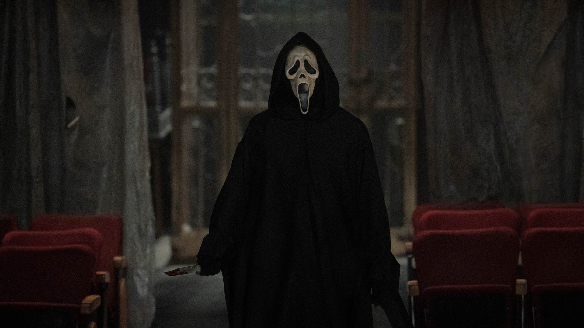 Ghostface brandishes a knife in a still from Scream VI