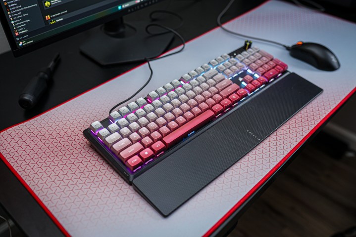 The Corsair Steel Crimson keyboard sitting on a desk mat.