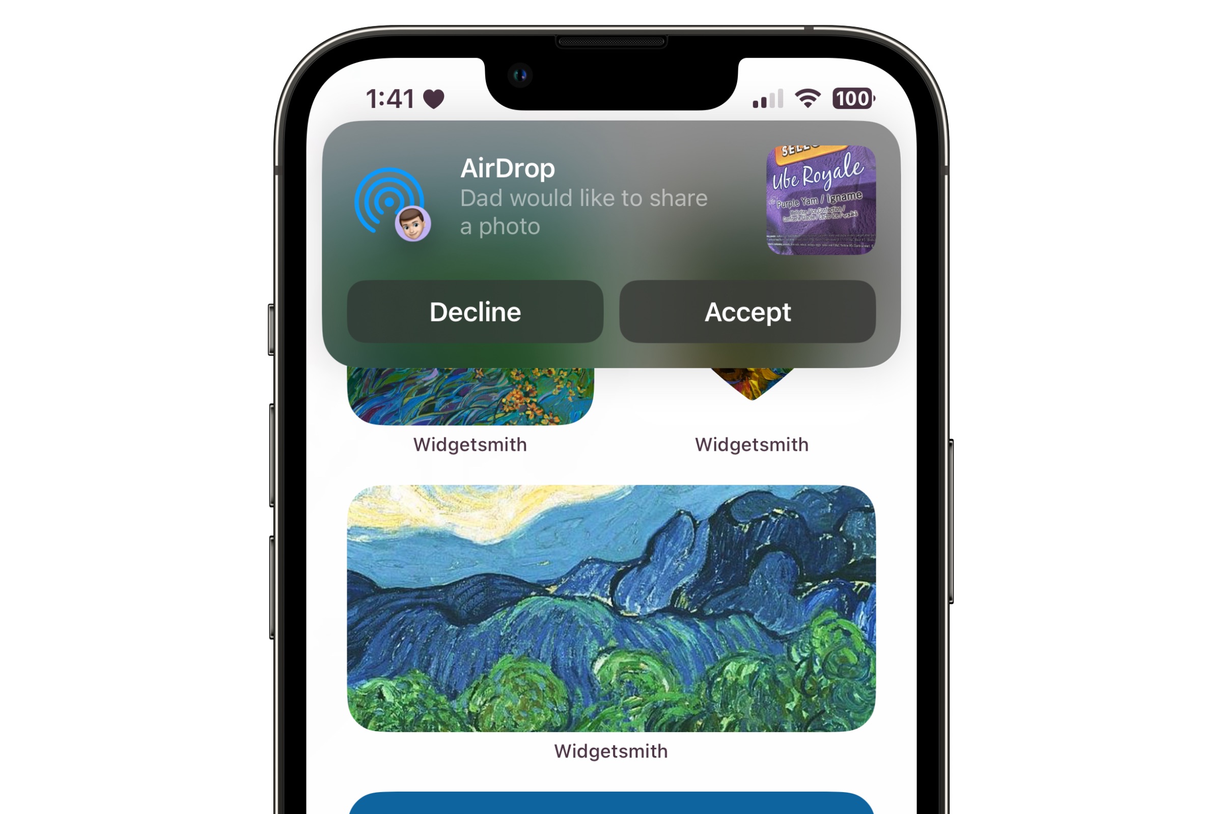 iPhone showing iOS 17 prompt to receive AirDrop photo transfer.