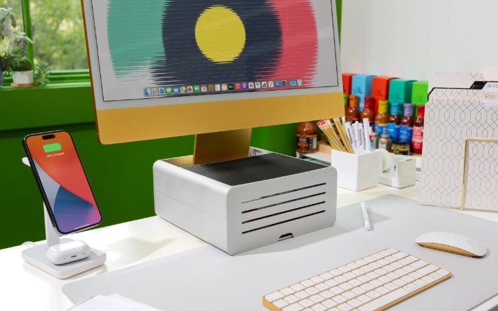 The iMac on a Twelve South stand on a white desk.