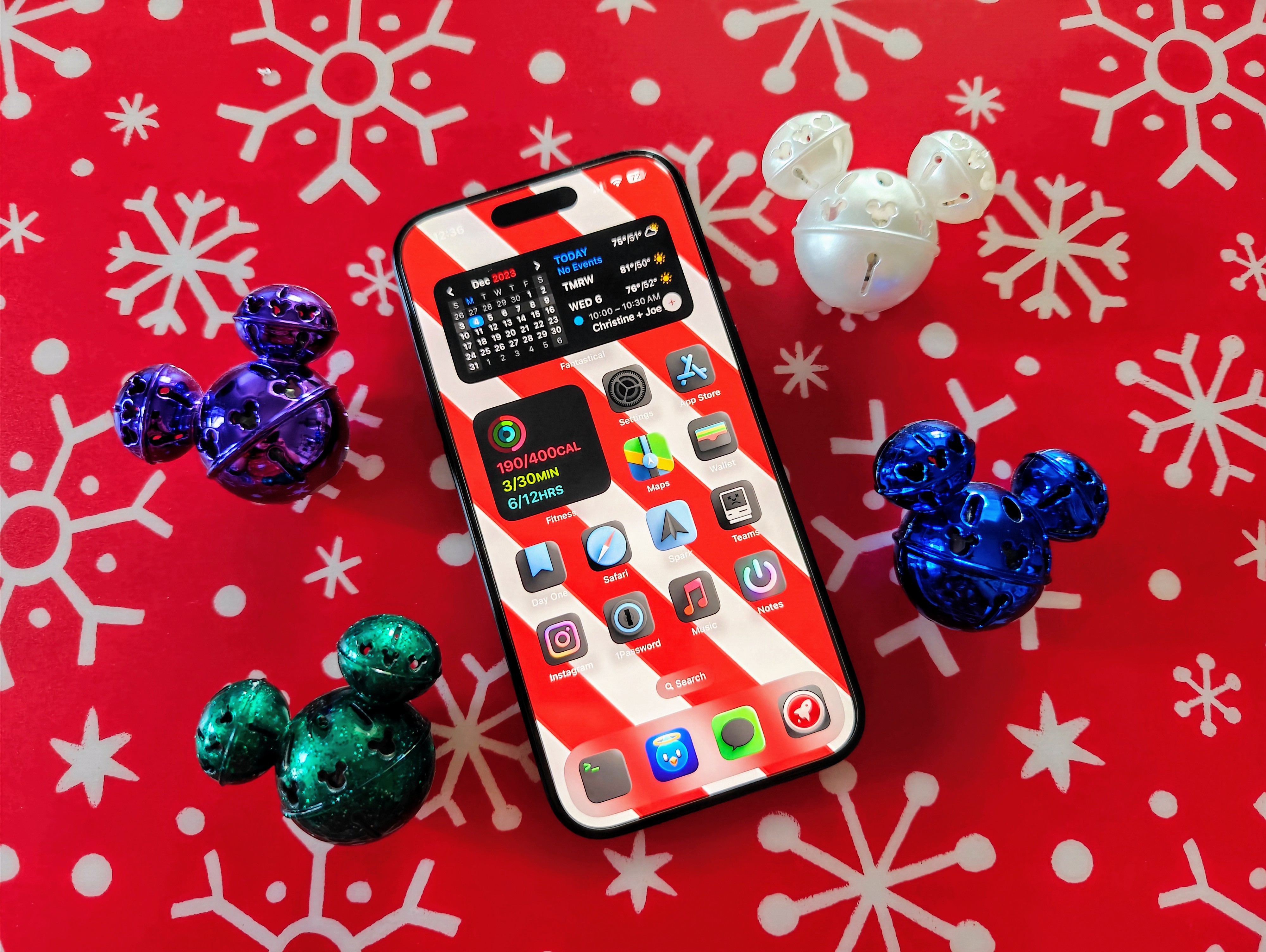 An iPhone 15 Pro home screen with festive decorations.